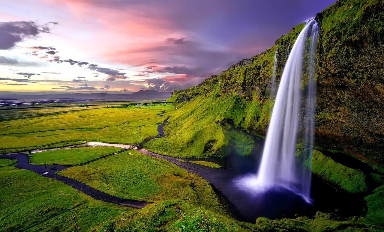 Seljalandsfoss waterfall pouring off the south coast cliffs of Iceland