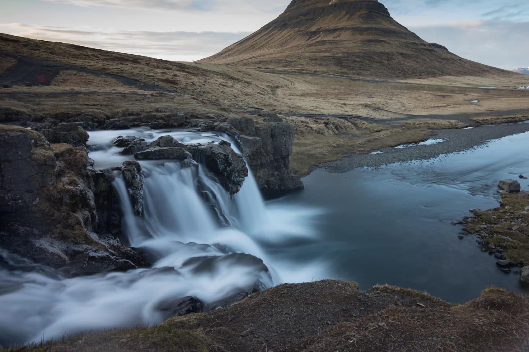 Kirkjufell mountain behind the Kirkjufellsfoss waterfall on Snaefellsnes